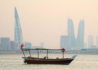 Traditional Arabian dhow in the middle of the sea in Manama, Bahrain.