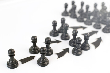 Black chess pieces are pawns on a white background. The concept of network marketing. Business.
