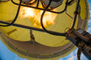 Hot Air Balloon Inflating. Hot Air Balloon fire flame. Hot air from a gas burner fills the dome of...