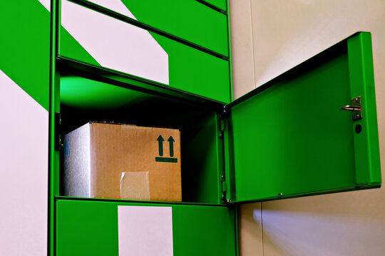 Post automat terminal and a parcel in it. Mail delivery packstation concept