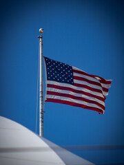 american flag on a blue sky