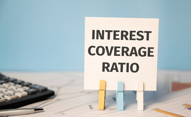 Fototapeta premium INTEREST COVERAGE RATIO text near financial reports and calculator.Financial concept.
