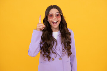 kid in jacket and sunglasses inspired with great idea on yellow background, inspiration.