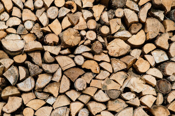 Woodpile of a birch firewood. Close-up, background. Texture.