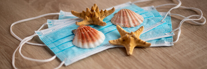 Face mask ready for travel and vacation - facemask with seashell and starfish