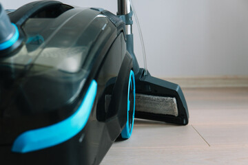 Technologies that facilitate wet cleaning. Modern household appliances. Vacuum cleaner in folded form. Front view