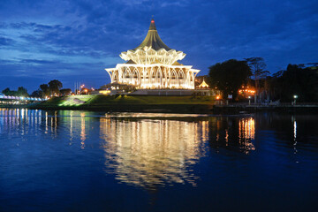 State Legislative Complex (lighted at night) on Sungai Sarawak (Sarawak River), Kuching, Sarawak (Borneo), Malaysia
