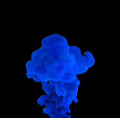 explosion of acrylic blue paint in clear water. Black background