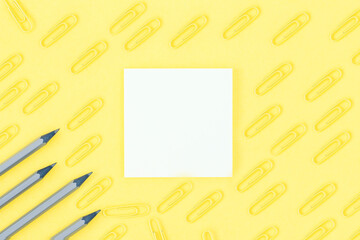 Creative office stationery pattern on yellow background. Flat lay, copy space. Brainstorming, notes concept.