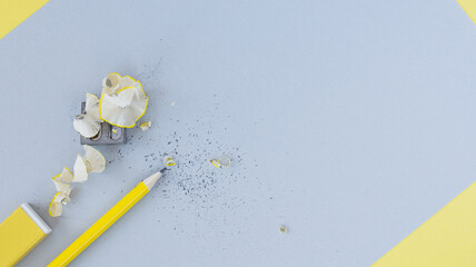 Stationary supplies - pencil, eraser and pencil sharpener on gray background. Follow your idea and back to school concept.