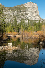 Fototapeta na wymiar view of mirror lake and north dome on a winter day at yosemite national park in california