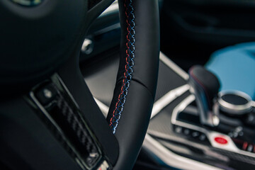Fototapeta na wymiar Steering wheel firmware in a sports car.