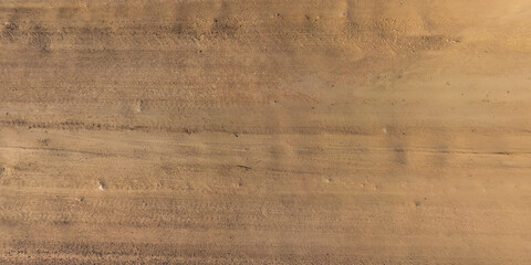 view from above on car tire tracks on texture of gravel road © hiv360