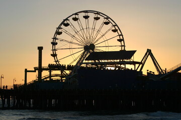 Santa Monica Ferris Wheel at Sunset in California on the Santa Monica Pleasure Pier from the Beach