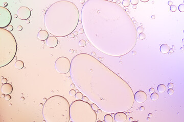 Colorful artistic of oil drop floating on the water. Abstract pastel bubble background.