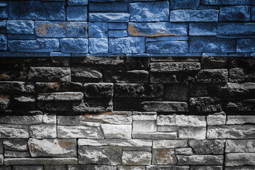 National flag of Estonia on stone  wall background.The concept of national pride and symbol of the country. Flag  banner on  stone texture background.