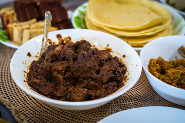 Rendang is a traditional Malaysian spicy meat that slow cooked in coconut milk and mixed spices, served during festive events like wedding, Eid Al Fitr and Eid Al Adha.