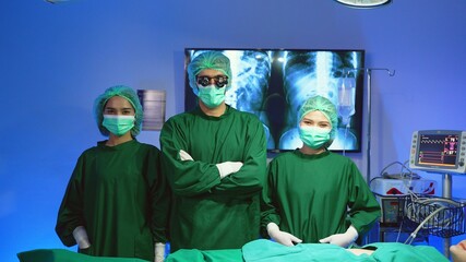 Portrait Of Medical Team Standing In Modern Hospital Building professional doctors and assistants in masks celebrating salary increase business success at workspace meeting conference.