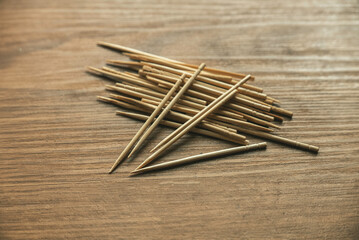 Wooden toothpick isolated on a wooden table.
