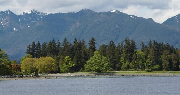 Stanley Park with mountains behind - Vancouver