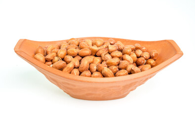 Peanuts in a bowl on a white background.