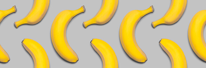 Bananas seamless pattern. Yellow and gray pantone colors.