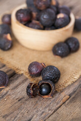 Soap nuts on wooden background