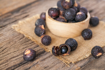 Soap nuts on wooden background