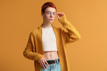 Non-binary teenager on color background - obrazy, fototapety, plakaty