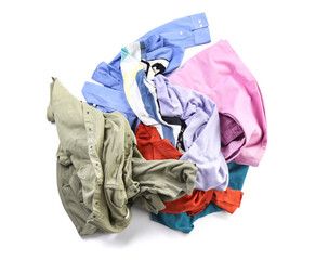 Heap of different clothes on white background