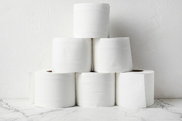 Rolls of toilet paper on light background