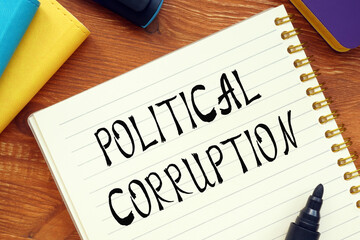 Financial concept meaning POLITICAL CORRUPTION question marks with phrase on the sheet.