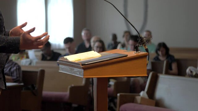 Close up on preacher's hands