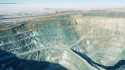 Slopes of open-pit copper mine in daylight