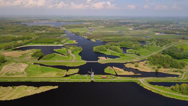 Nature park Het Twiske typical dutch nature scene with historical wind mill in The Netherlands