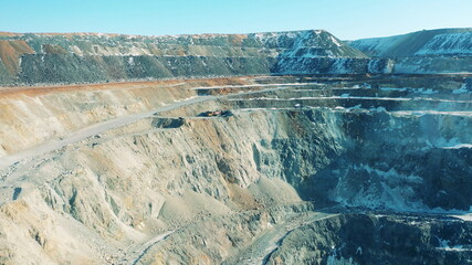 Roads and snowy slopes of an open-pit mine