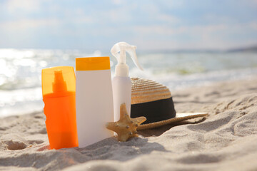 Sunscreens on the beach near the sea close up