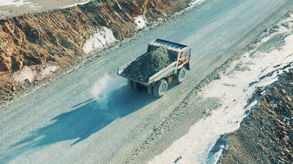 Top view of a truck loaded with ore on the quarry road