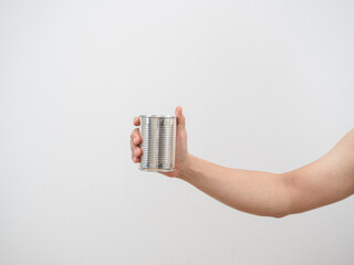 Man hand holding metal can empty on white isolated backgroud