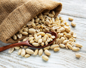 Peeled peanuts in a burlap bag