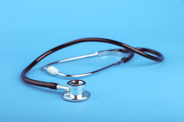 stethoscope on a blue background with copy space