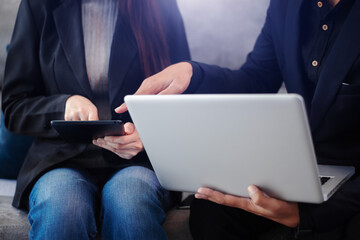 Businessmen team or financial data analysts working with tablets and laptop computers and data graphs together. Plan to analyzing projects in the office.