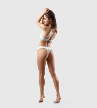 White bikini mockup for design on sexy girl isolated on background, back view