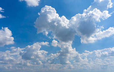 Naklejka na ściany i meble Transparent white clouds on blue sky background with sunlight