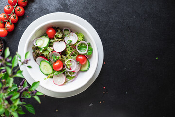 vegetable salad radish, cucumber, mix leaves meal snack summer menu diet vegan or vegetarian food copy space food background rustic top view