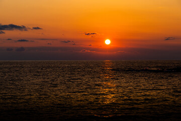 Sunset over sea. Dramatic sky.