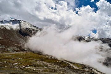 When the clouds touches the mountains. A view when you visit to Rohtang Pass located in Manali- India
