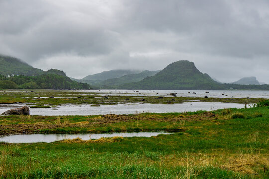 View on the St Lawrence river and Baie &agrave; l'Orignal (Moose bay) in Parc National du Bic near RImouski in Bas St Laurent (Quebec, Canada) on a rany and moody day