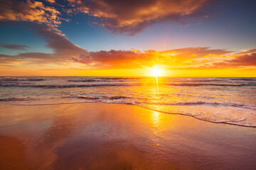 Beach sunrise over the tropical sea
