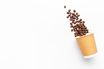 Paper cup with coffee beans. Coffee concept